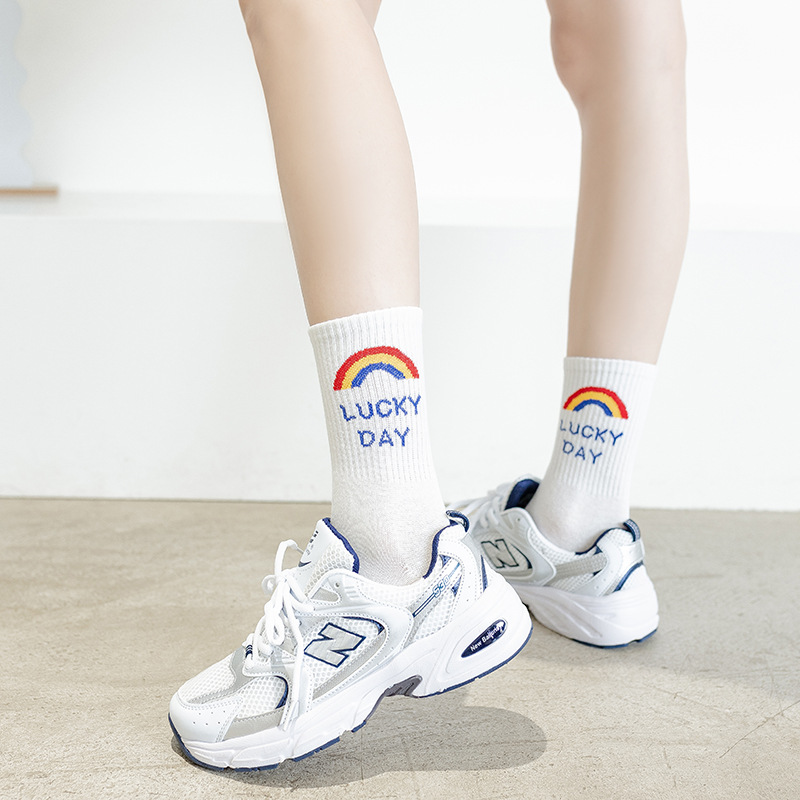 Women's mid-calf trendy brand spring and summer Japanese-style smiling black and white long calf socks, pure cotton versatile couple basketball sports socks details Picture