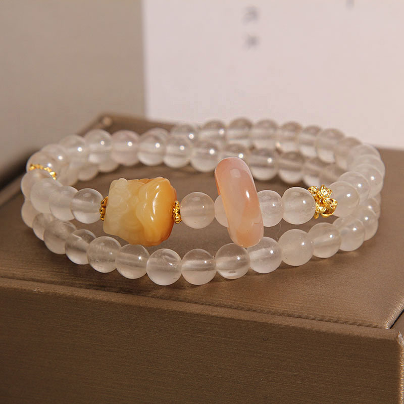 The new Chinese-style golden thread jade double-ring bracelet is exquisite, niche and light luxury. It features a lion dance running ring with multiple layers of beaded bracelets and jewelry details Picture