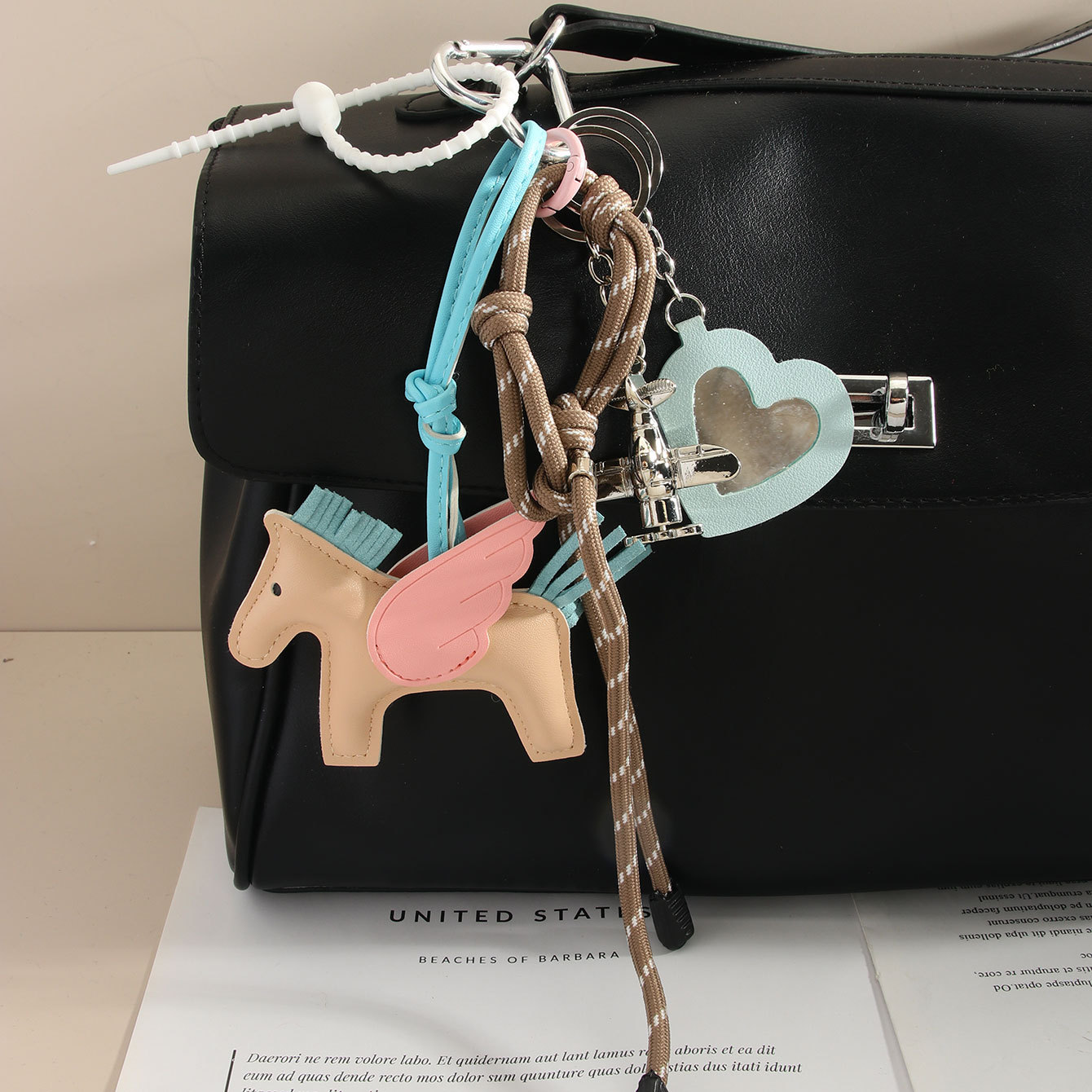 miu series H Pegasus bag Pendant, airplane letter keychain, lanyard, leather bag pendant, leather hanging accessory Specification image