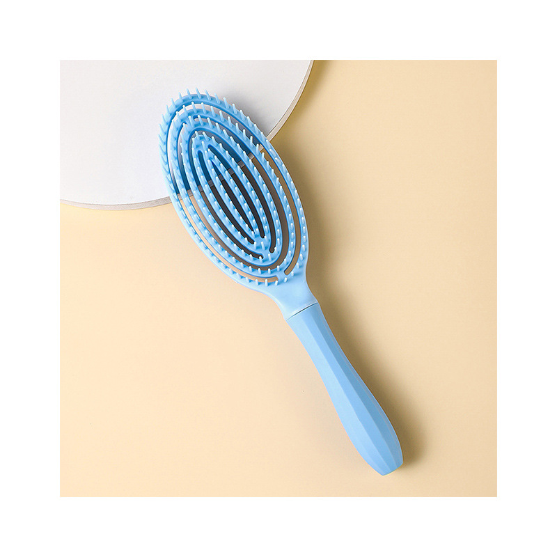 镂空按摩梳椭白底实物图