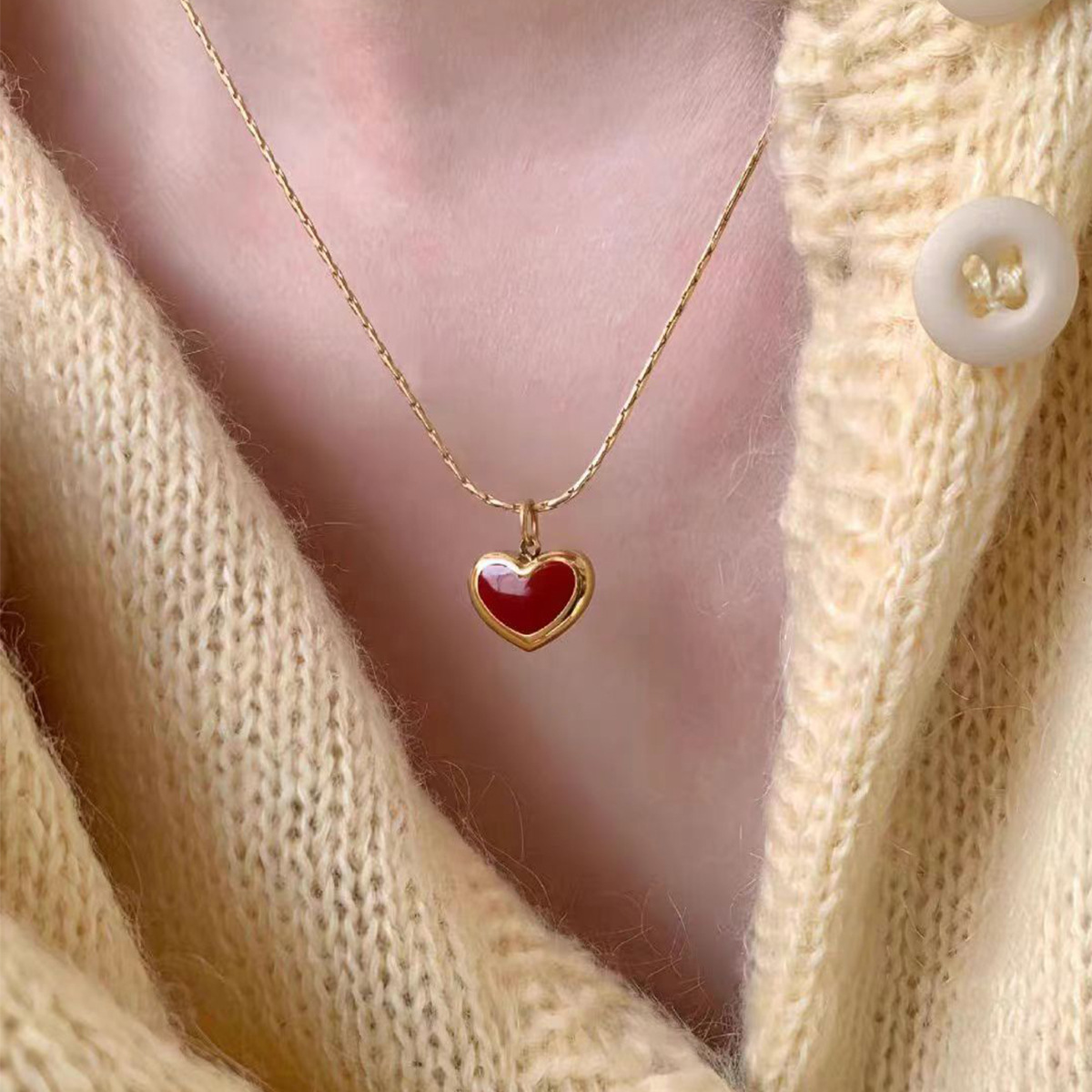 This sweet red heart-shaped necklace from Korean style is elegant, delicate and compact. It is made of titanium steel and plated with 18K gold, making it a versatile collarbone chain for women