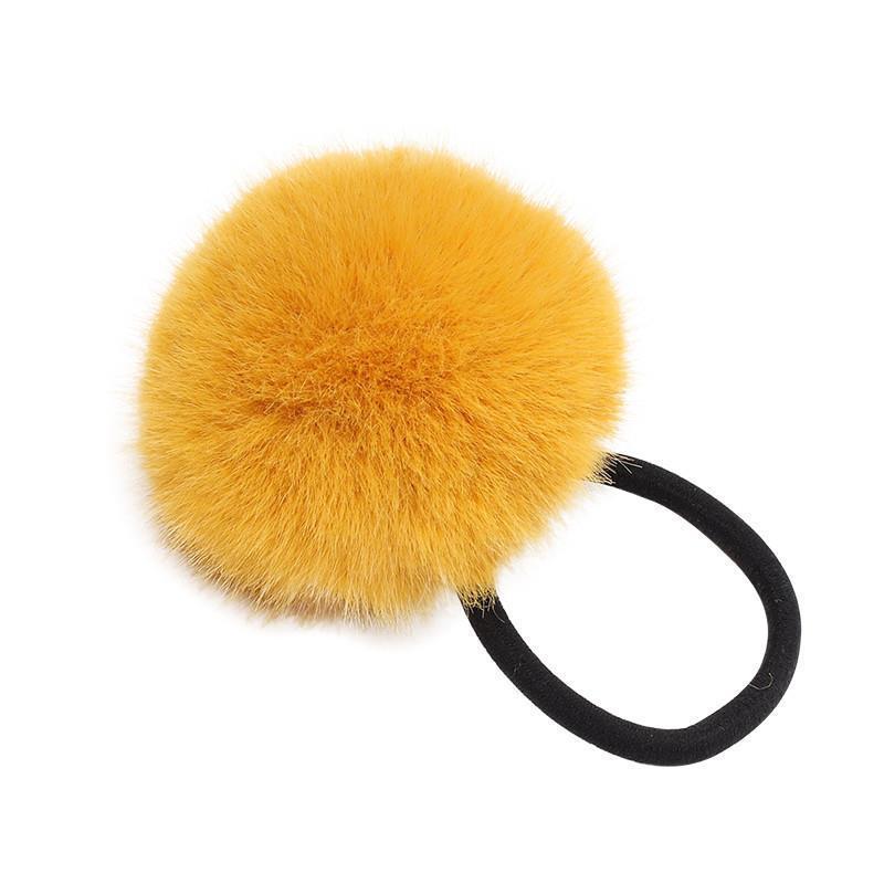 The cute and colorful plush hair tie for autumn and winter is super soft. The fluffy pom-pom hair band won't hurt the hair. Girls tie their hair with leather bands Item Picture