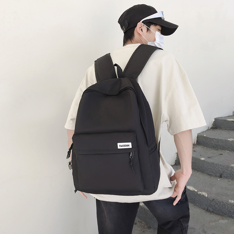 Wholesale of simple solid-color outdoor travel backpacks for college students in cross-border casual backpacks and student schoolbags