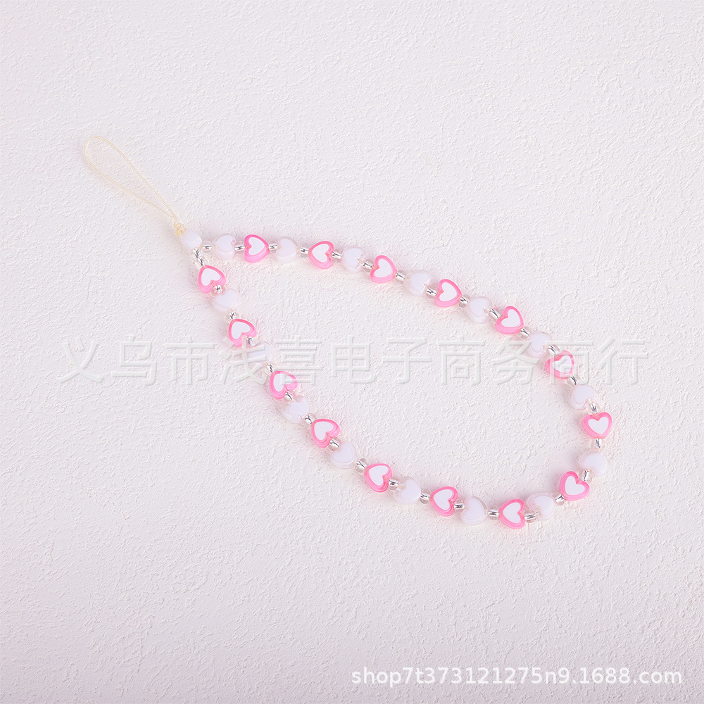 New colored rice bead mobile phone chain from ins in Europe and America, pearl smiling face beaded heart-shaped mobile phone accessory pendant for women details Picture