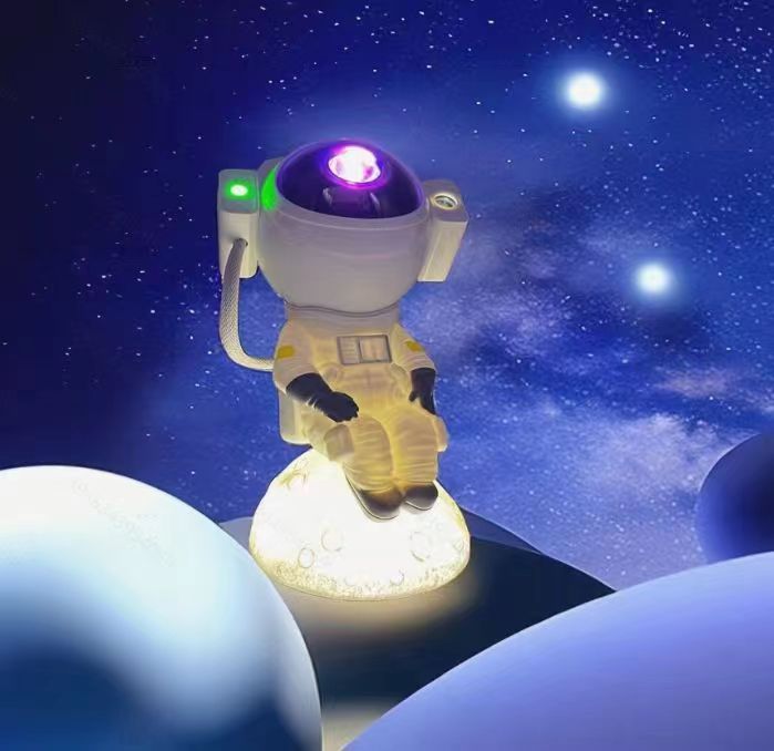 新款星空灯蓝牙音响月亮投影床头氛围灯生日礼物激光宇航员小夜灯