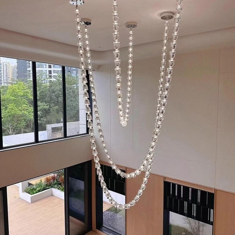 Light luxury villa duplex with a high ceiling living room chandelier, 2025 new designer loft apartment crystal necklace chandelier details Picture