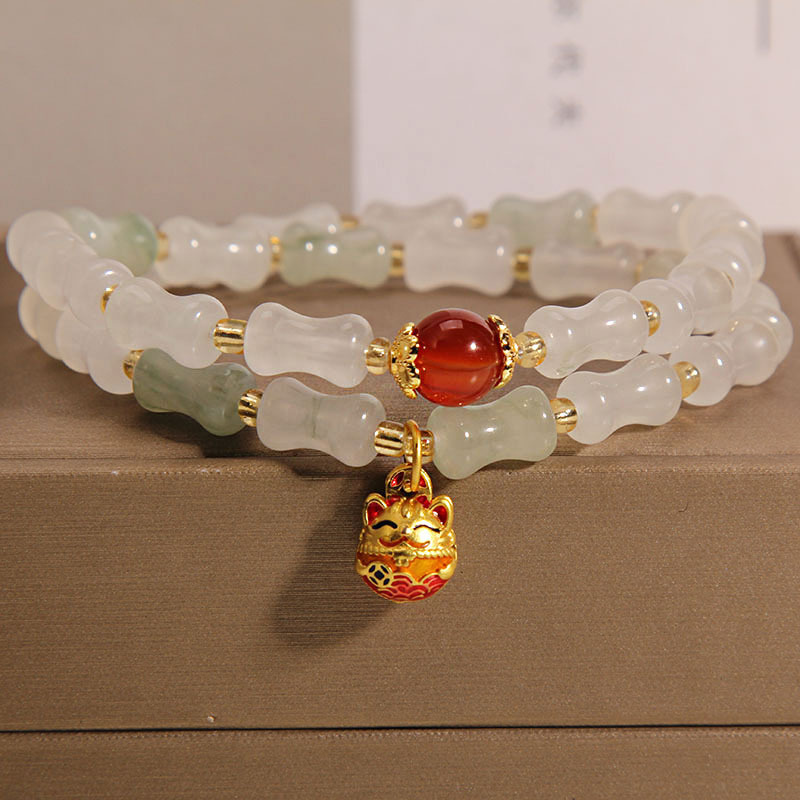 The golden silk jade double-ring bamboo joint bracelet for women on Instagram is a niche, light luxury, and high-end charm that keeps rising. It's a Maneki Neko pendant bracelet details Picture