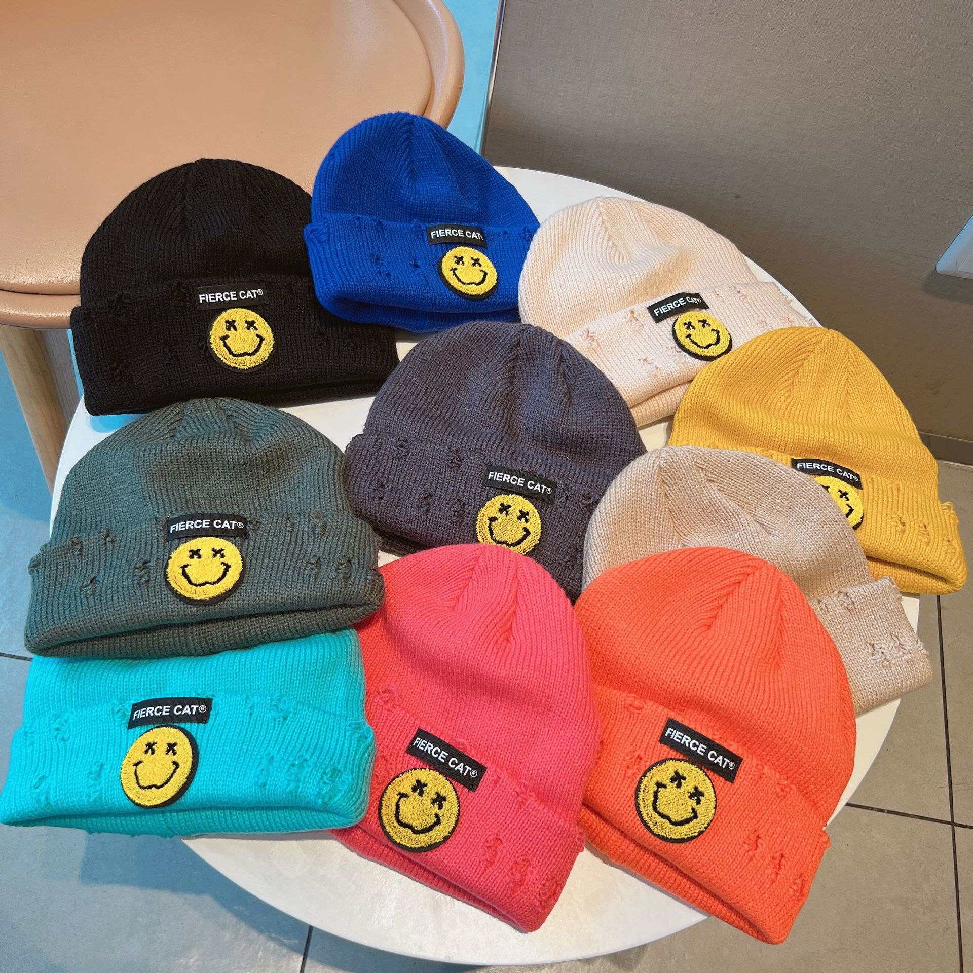 Children's smiling knitted hat, autumn and winter ripped hat, warm pullover, cold hat, Korean version, versatile woolen hat for boys and girls details Picture
