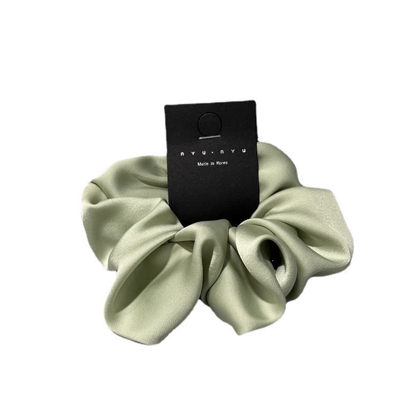 The elegant and creamy satin large intestine hair band from Dongdaemun, South Korea, is simple and versatile. It is a hair tie accessory for women Item Picture
