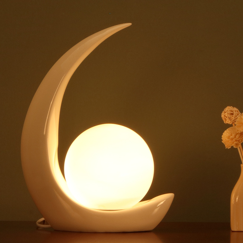 Creative moon resin personalized bedroom bedside lamp, modern and simple living room decoration, study desk lamp, one-piece consignment Item Picture