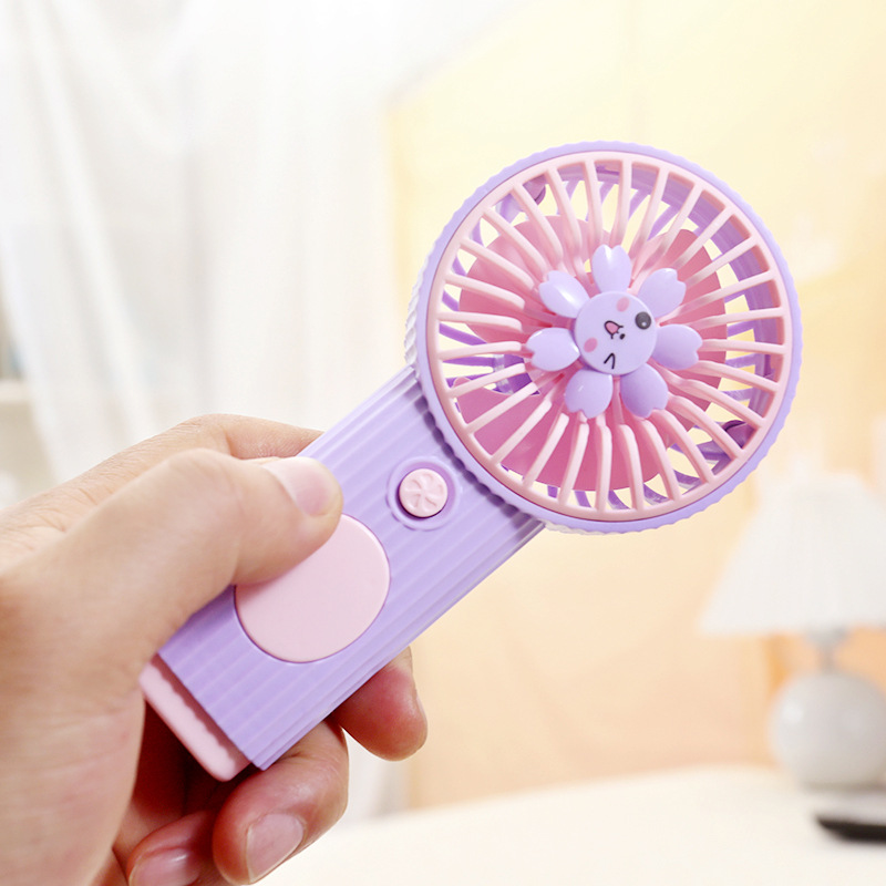 The cute cartoon little flower is holding an electric fan Application Scenario