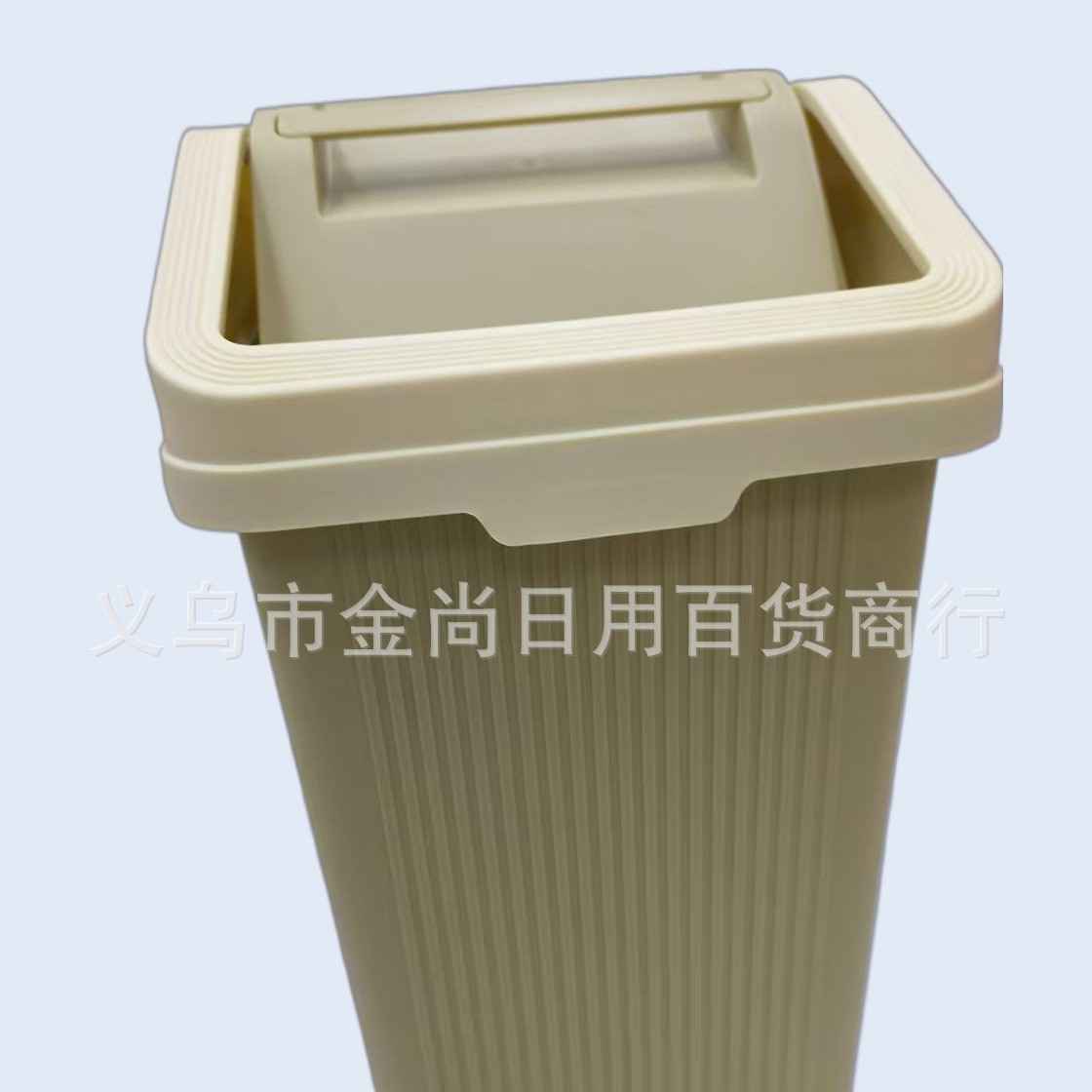A simple kitchen trash can with a flip lid is a practical household storage trash can