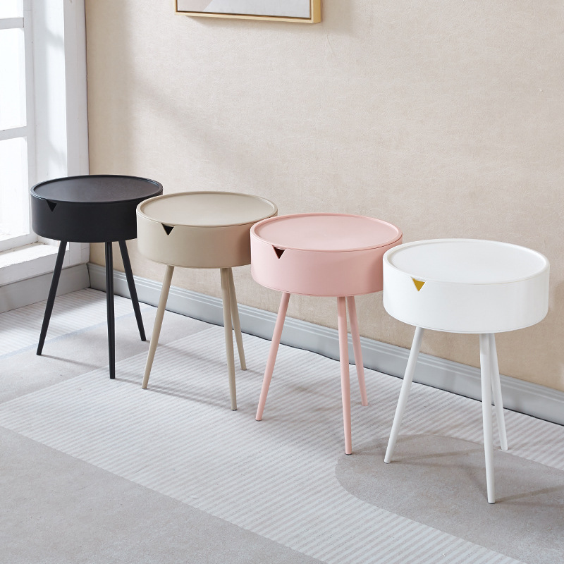 A round triangular table, a small table by the bedside of a girl in the bedroom, a modern and simple mini round table