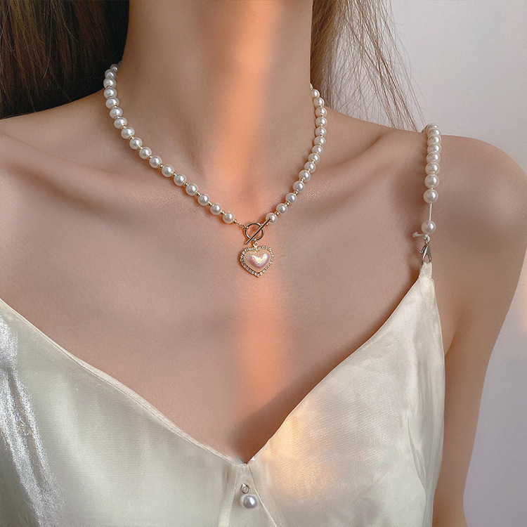 Japanese and Korean pearl heart-shaped necklace, women's real gold color retention electroplating, trendy and niche design sense, elegant collarbone chain, versatile neck chain