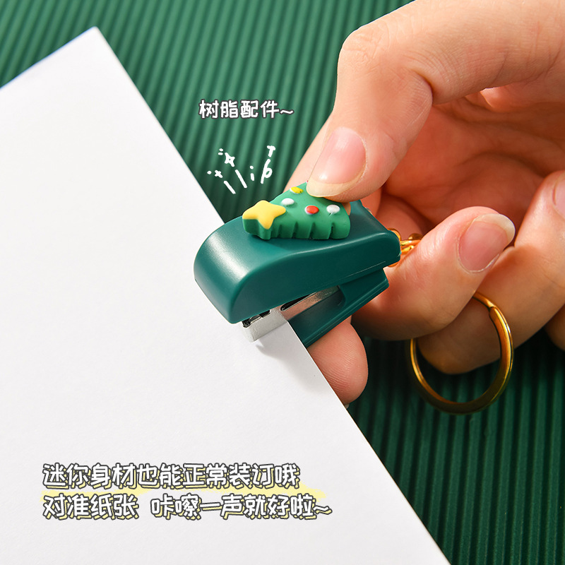 Christmas cute cartoon mini stapler, student small stapler with keychain, Christmas small gift binding machine Application Scenario