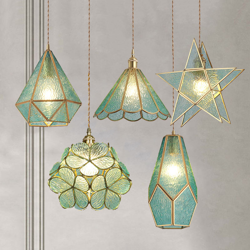 A small crystal single-head pendant lamp for the bedside in a Nordic bedroom, a postmodern minimalist dining bar counter, a popular light luxury all-copper pendant lamp details Picture