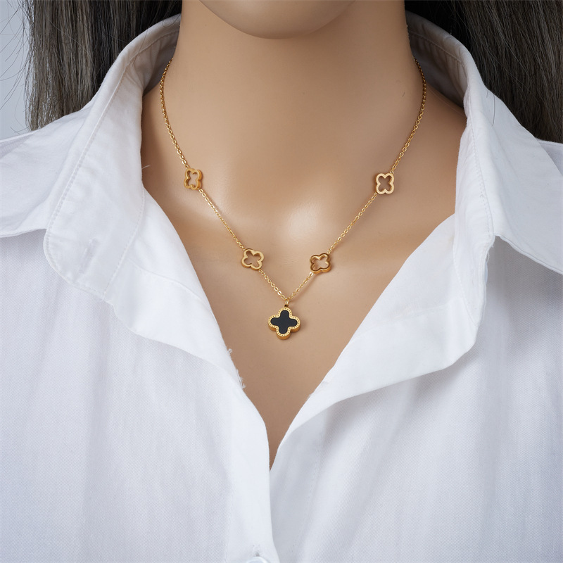 A niche design double-sided four-leaf clover titanium steel necklace with a fashionable and elegant feminine touch, featuring a light luxury hollowed-out flower mother-of-pearl collarbone chain and a personalized accessory Application Scenario