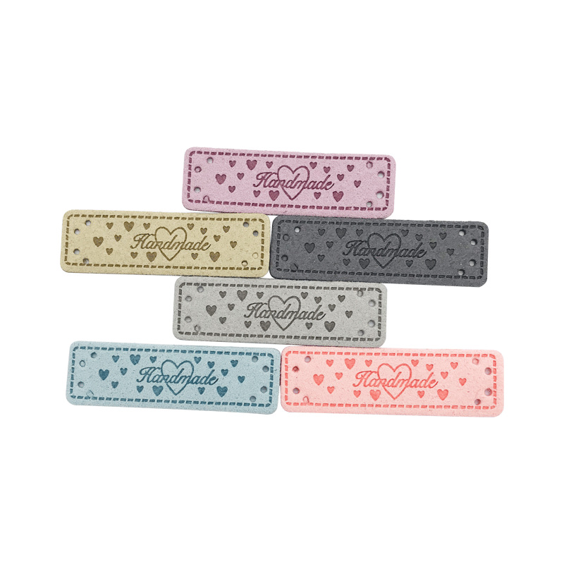 现货彩色麂皮/handma/童装服装商标细节图