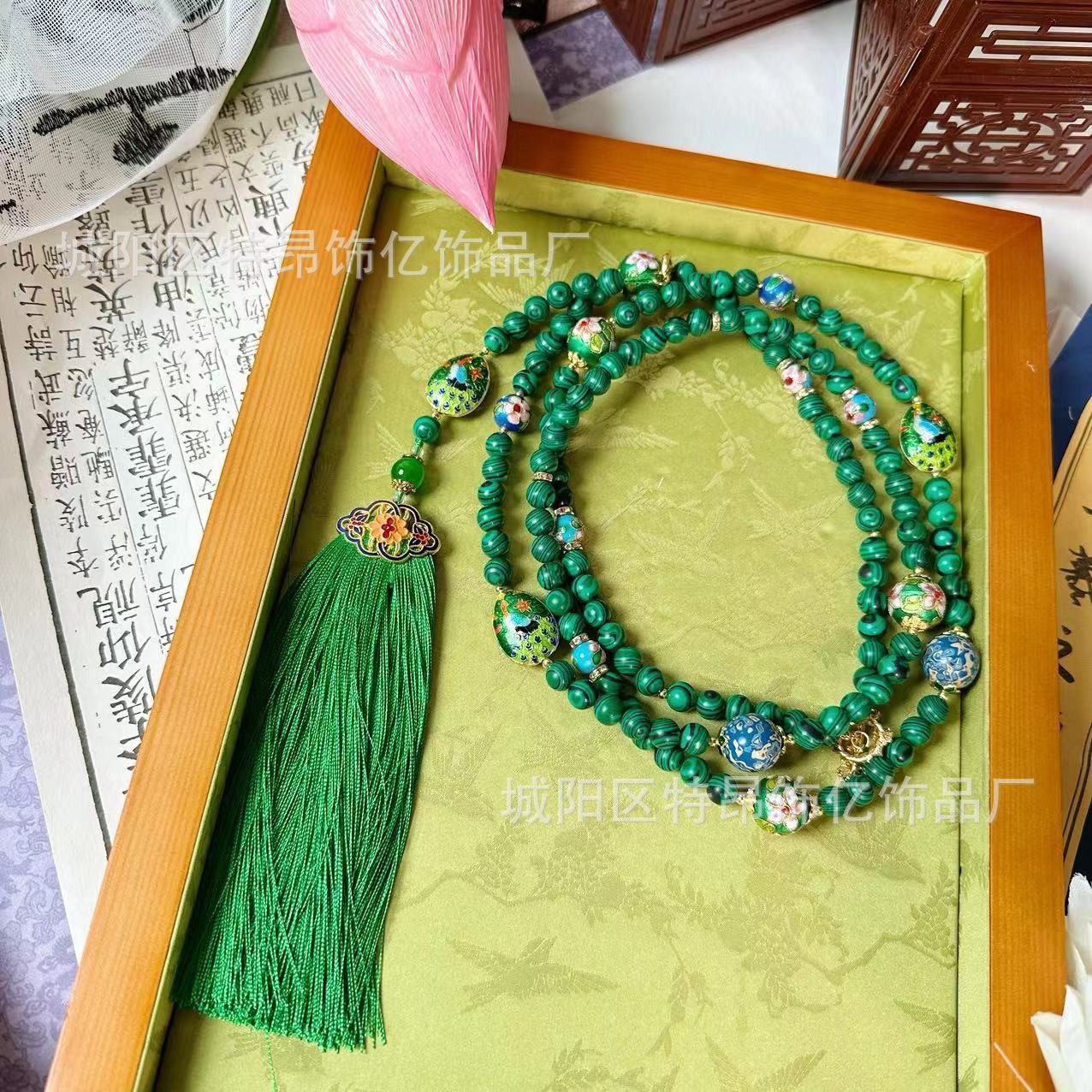 A new Chinese-style mid-length necklace with a slanted cross chain and tassels, exuding a sense of high-end luxury and a light green color Application Scenario