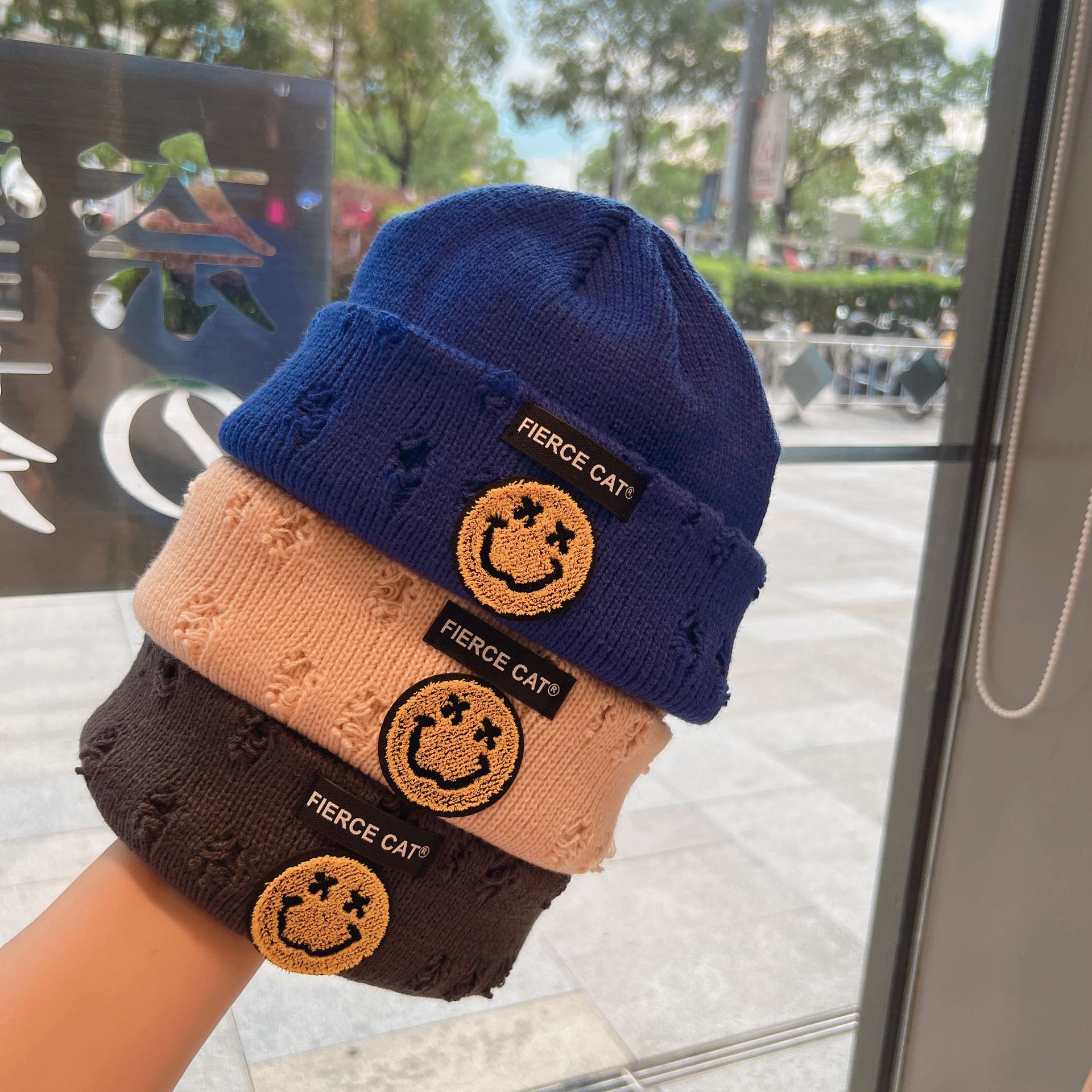 Children's smiling knitted hat, autumn and winter ripped hat, warm pullover, cold hat, Korean version, versatile woolen hat for boys and girls Application Scenario