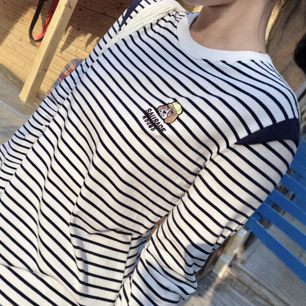 This is a new spring T-shirt for women, featuring a unique design with embroidered stripes on a husky. It has a straight shoulder and a slimming look, with a round neck and long sleeves Specification image