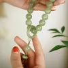 The peach holds a jade-like hand, twirling an ancient-style bracelet, mobile phone chain, Hanfu accessories, and is versatile. It plays with various objects and tassels Application Scenario