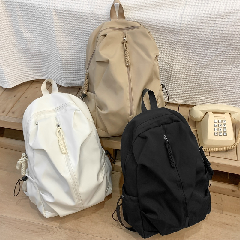 Wholesale of large-capacity schoolbags for men, women, high school and college students, simple cross-border leisure sports backpacks and travel backpacks