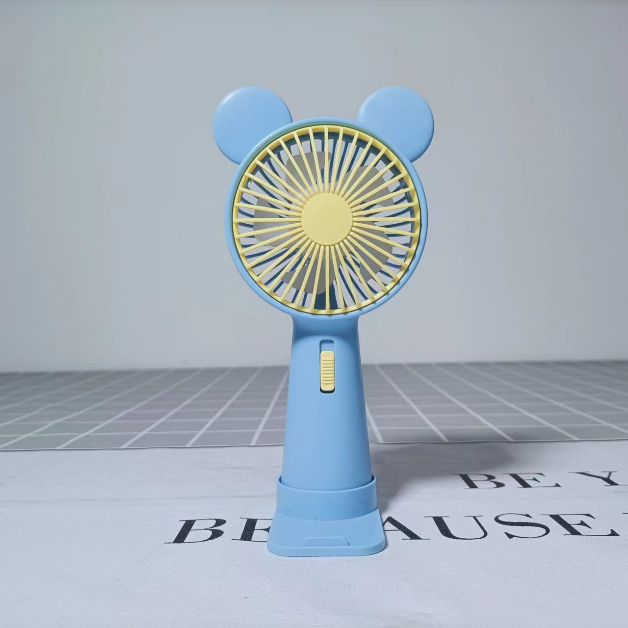Holding a little bear fan in summer details Picture