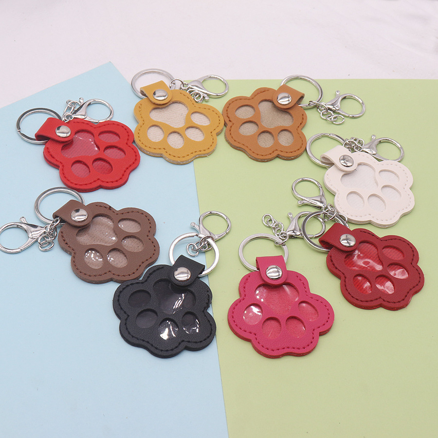 Paw print cat commemorative plate, popular pet dog hair portable keychain pendant, PU hair tag storage bag for pets Specification image