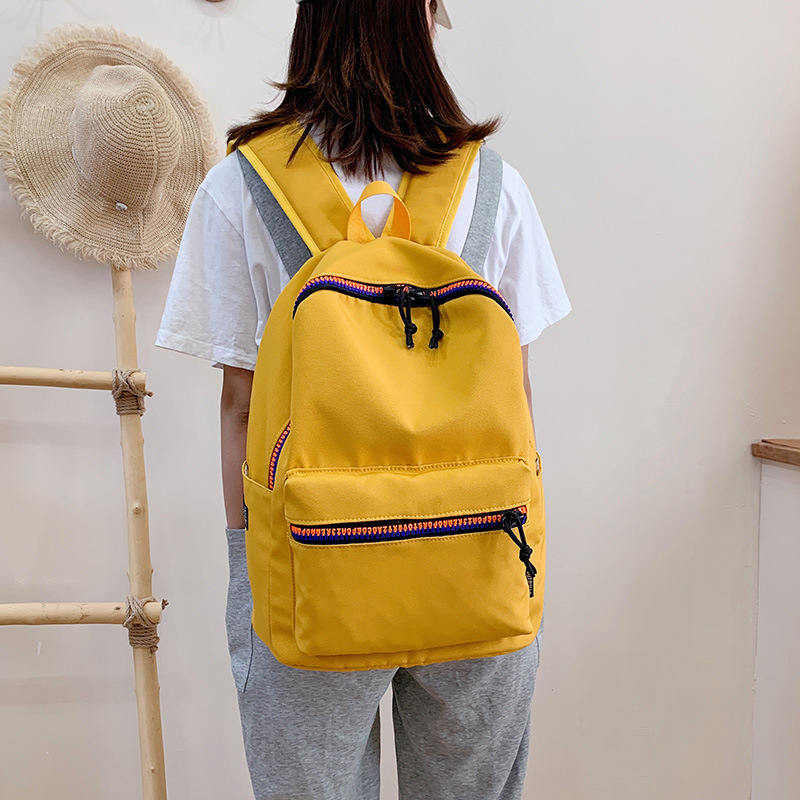 双肩包女新款潮流书包中学大学生休闲旅行中性引闪纯色牛津布背包详情12