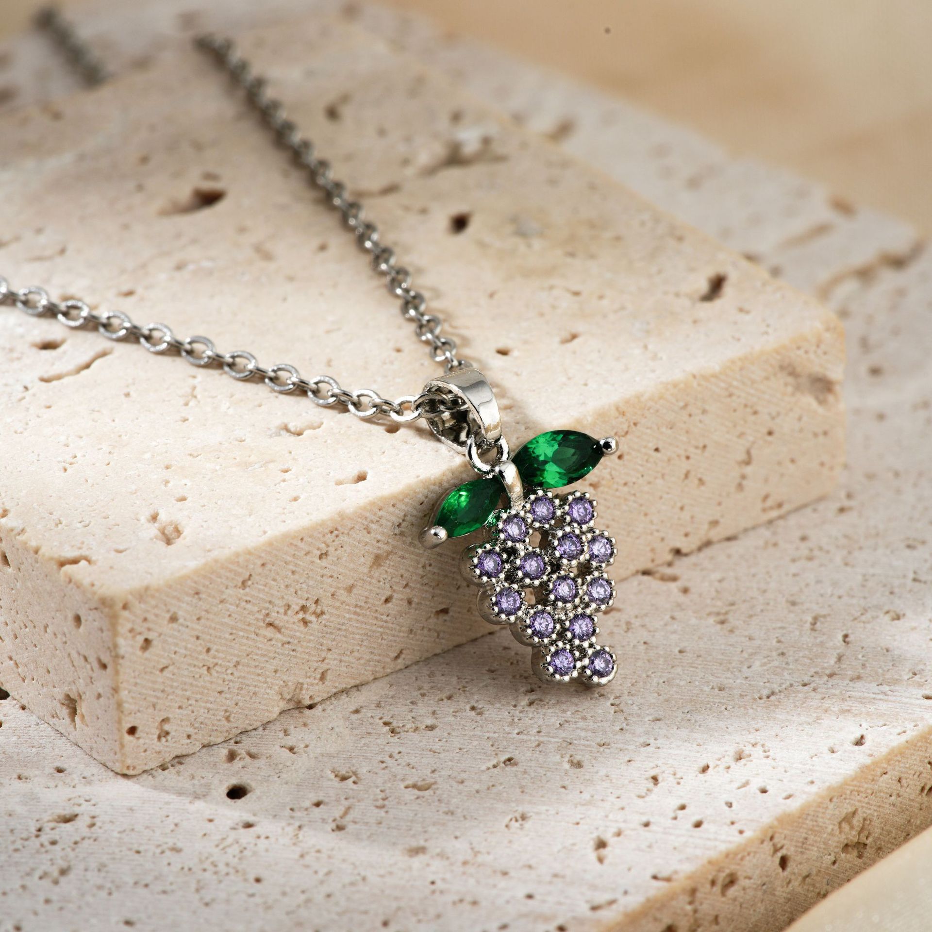 The new 2024 exquisite and fashionable copper-inlaid zircon grape pendant from Kashi is a sweet and popular stainless steel necklace accessory Application Scenario