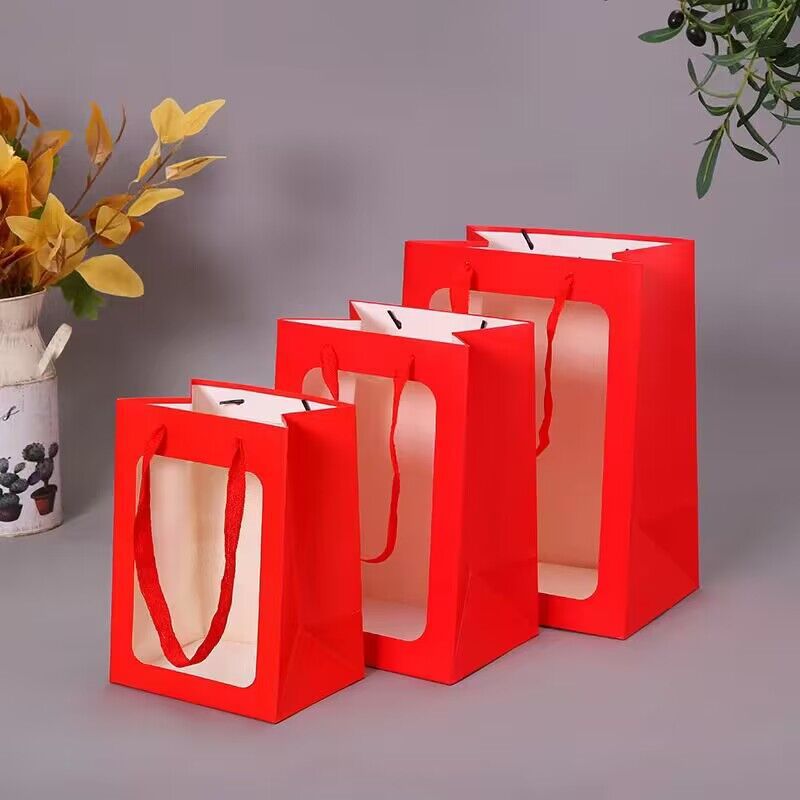 Wholesale of new creative windowed single-color handbags, square-bottom paper bags, hand-held paper bags, flower packaging bags and gift bags Specification image