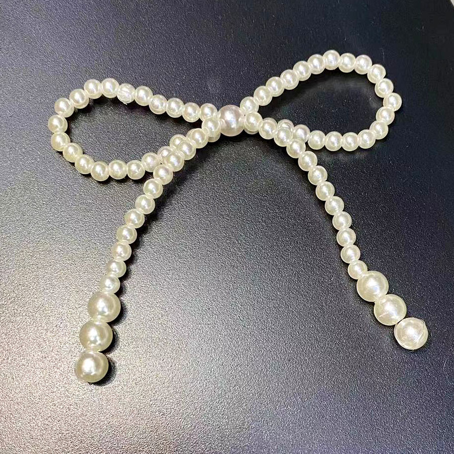 Wholesale of Japanese and Korean jewelry, clothing, imitation pearl bow accessories, shoes, hats, hair accessories, wedding dresses, clothing, bags, and decorative accessories details Picture