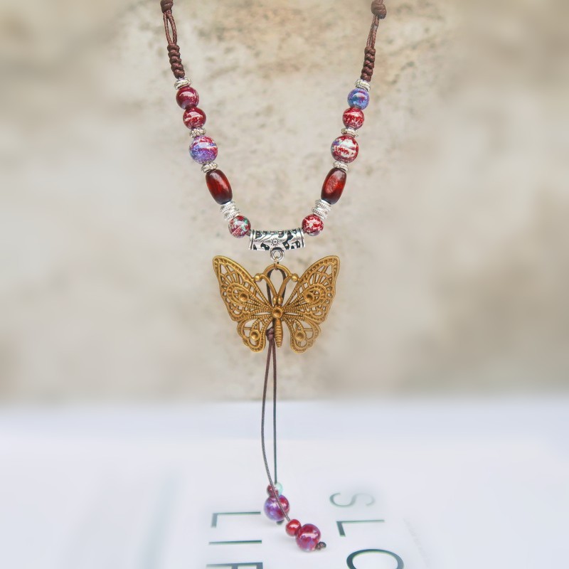Wholesale of Guifei Butterfly Ethnic Style ceramic long sweater Chain, women's ancient style pendant, retro Chinese style butterfly necklace details Picture