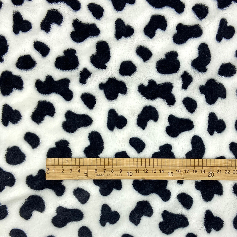 现货 双面法兰绒奶牛纹印花绒布小奶牛珊瑚绒家居服睡衣浴袍面料