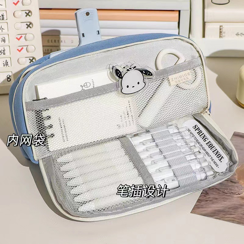 Macaron solid color multi-layer separated pen case, high appearance level, large capacity, hemp rope button, ins high-end stationery box Application Scenario