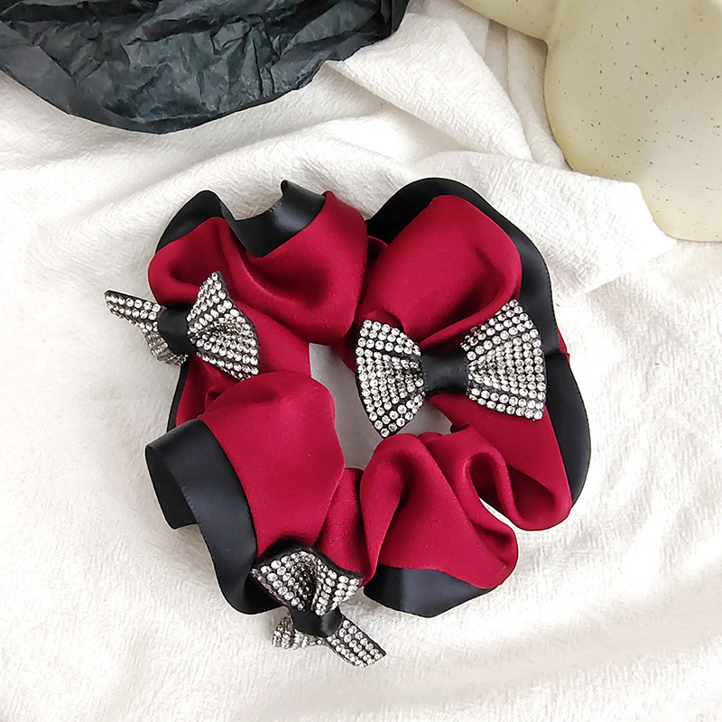 A new high-end texture single-sided linen bow with diamond-encrusted large intestine hair band and hair tie from South Korea, a popular hair accessory for women details Picture