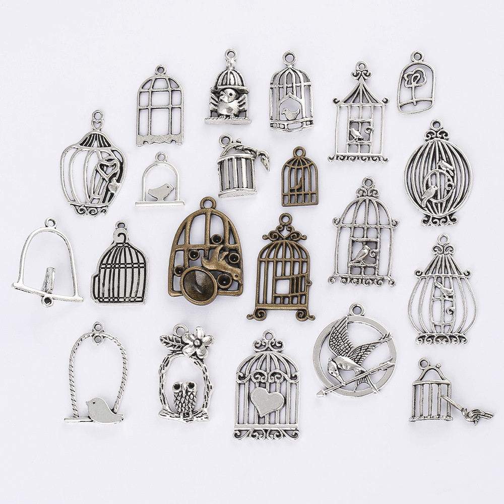 Yiwu alloy DIY jewelry accessories, birdcages, window hollowed-out landscape pendants, and embossed pendants are selling well Item Picture