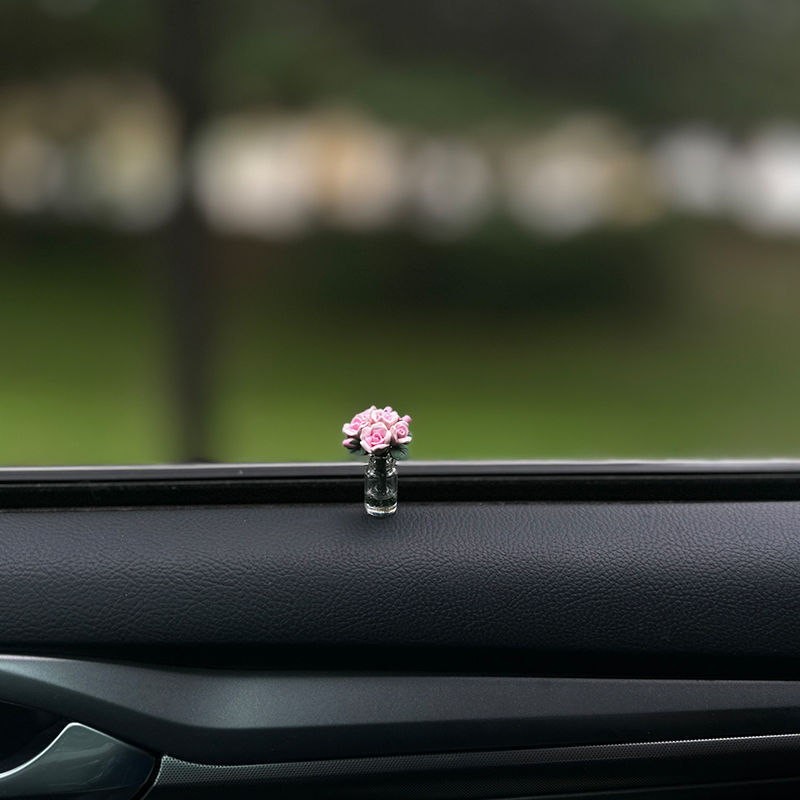 The charming rose-shaped car center console window decoration is a mini car accessory, making it unique and beautiful for ladies inside the car