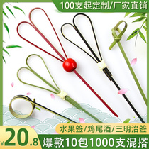 Disposable fruit skewer with a burger on a bun on a cocktail with a sugar gourd on a scissors on an art Deco skewer