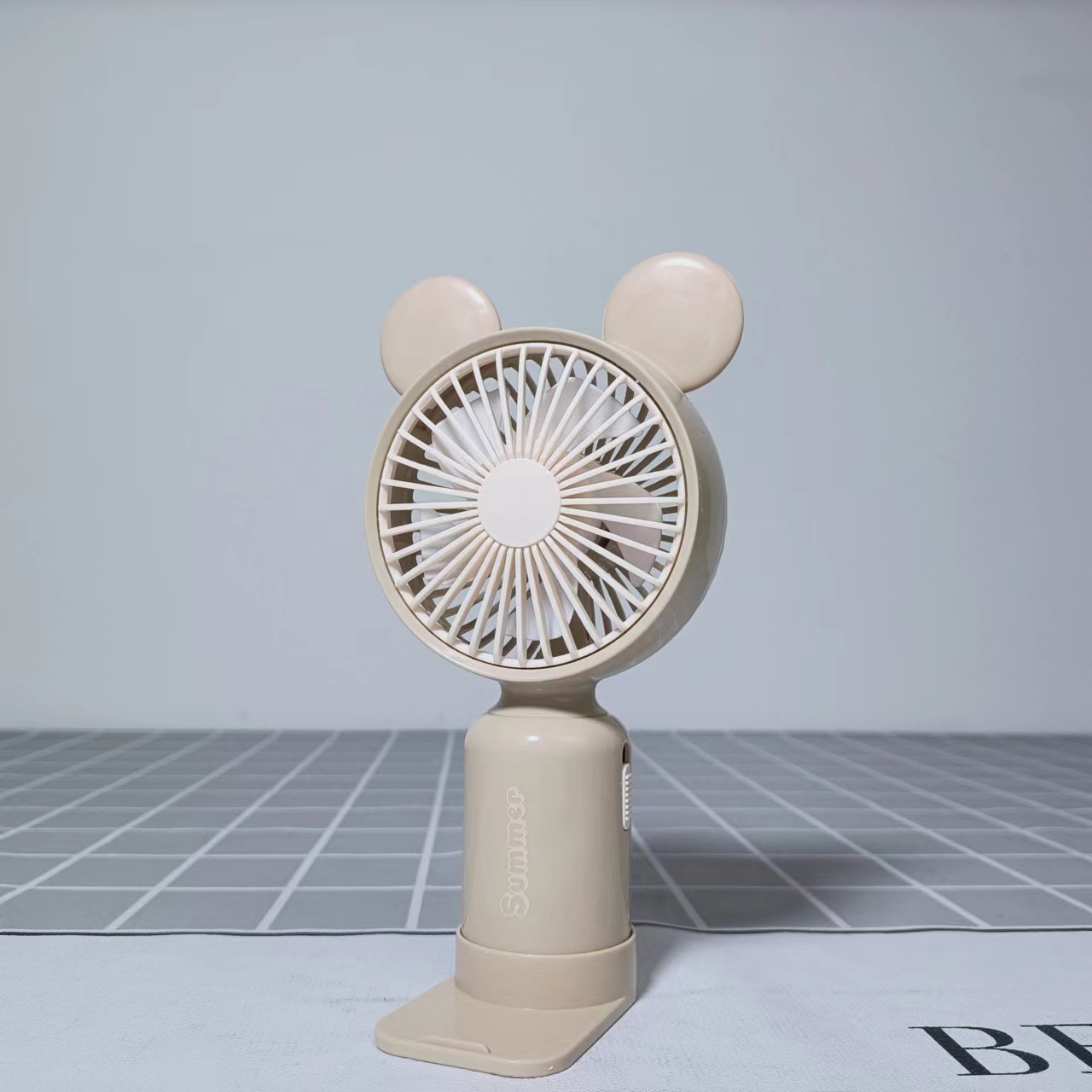 Holding a little bear fan in summer Application Scenario