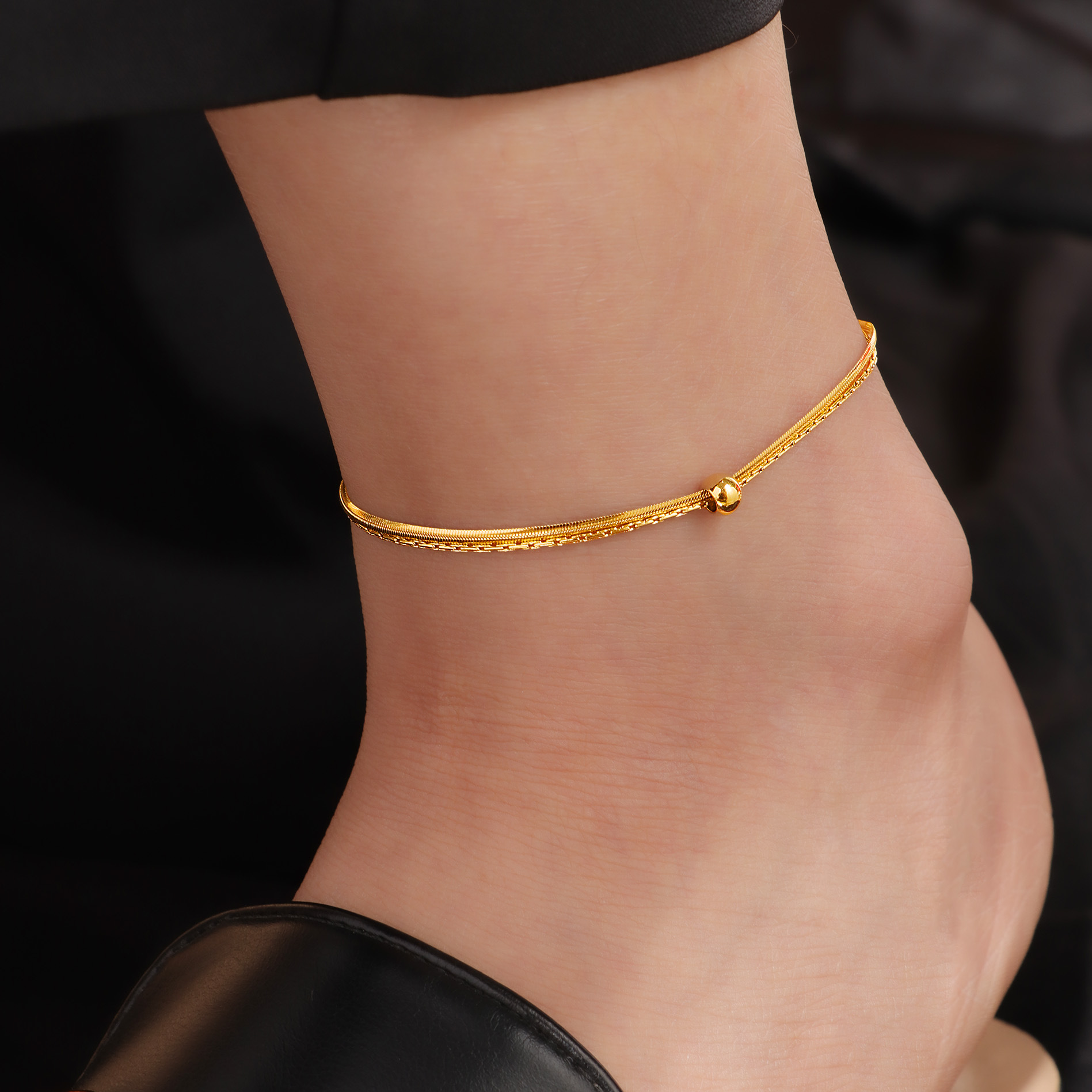 Double-layer snake bone anklets with movable beads, women's titanium steel gold summer new style, versatile and non-fading small gold ball anklets details Picture