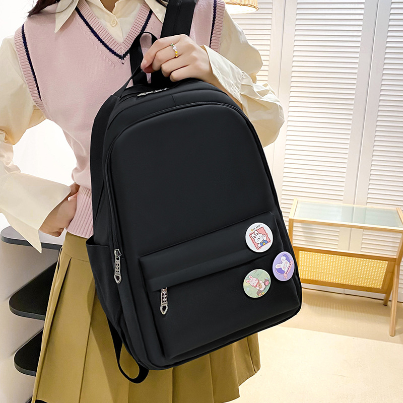 The 2024 new solid-color Korean-style simple backpack has a high appearance level and large capacity shoulder protection. It is a backpack that reduces the burden on college students details Picture