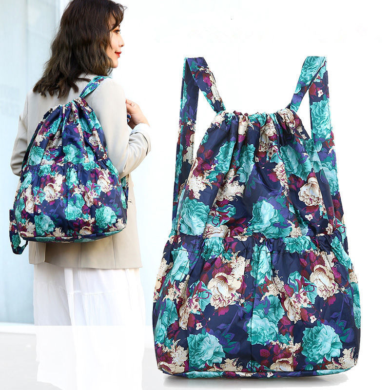 Cross-border floral fabric drawstring bag, drawstring large capacity backpack, women's folding portable shopping bag, outdoor travel backpack details Picture