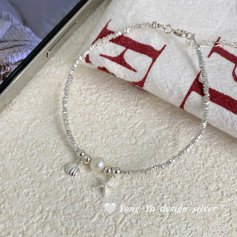 This all-silver star shell bracelet is a sweet and unique Korean version for women. It features an exquisite and high-end design. It's a perfect gift for your best friend as a hair accessory Specification image