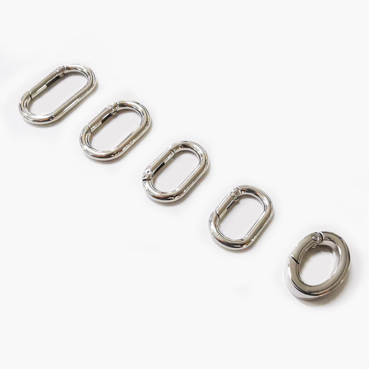 Cross-border supply of in-stock spring coils for bags, clothing, hardware accessories, luggage, open rings, oval spring buckles details Picture