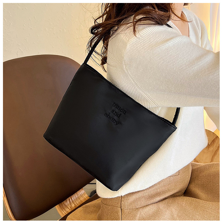 This is a rare and high-end mucu and ebony fashion embroidered nylon versatile underarm single-shoulder handbag for women Application Scenario