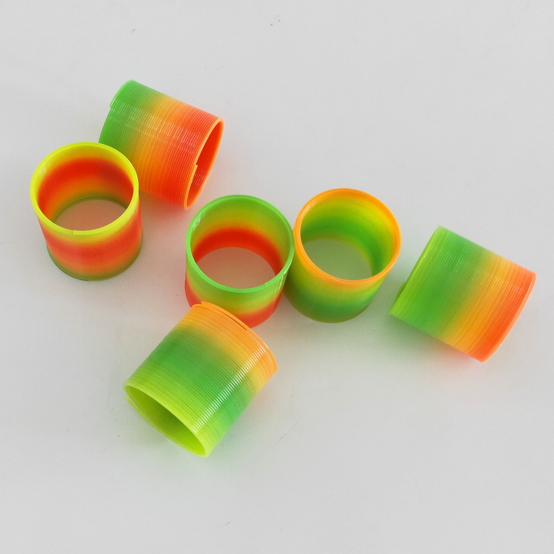 Small Rainbow Ring Wholesale Spring Folding Ring To Push Small Gifts Night Market Stalls Selling Children's Toys Application Scenario