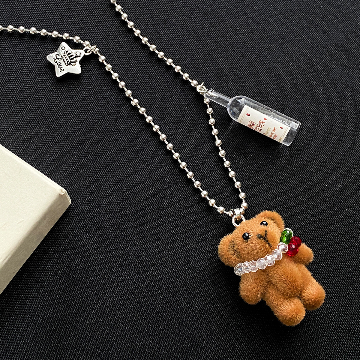 Cute cartoon cherry brown plush bear wine bottle pendant necklace for autumn and winter, Korean-style long hoodie chain accessory for women Application Scenario