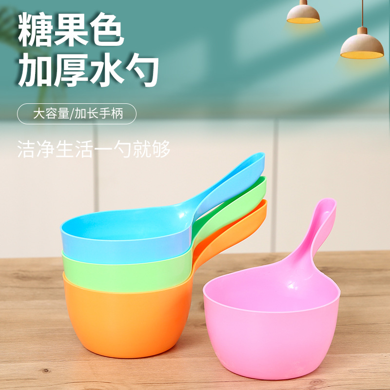 A large-sized creative water ladle with a long and thick plastic handle that won't break in the household kitchen. It's a hair washing spoon